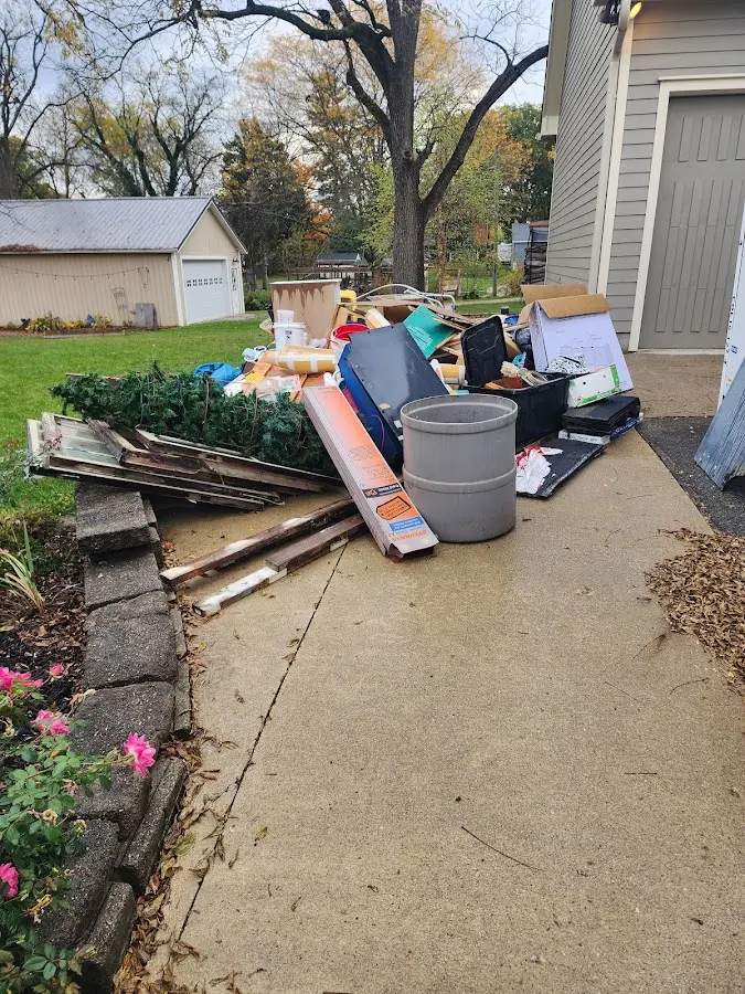 Dumpster being loaded with debris for Residential Dumpster Rental in Cupertino
